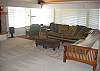 Large comfortable living area with fireplace and lovely ocean views.