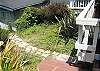 The backyard deck overlooks a small yard--extra room for a dog.