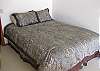 The fifth bedroom actually used to be a completely separate studio.  This is a queen sized bed with a brand new featherbed top.  This very large room also has a double futon.  There is a full bathroom to the left, with heated tile floors.