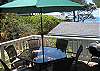 The back patio has shaded seating for six people, and there is a charcoal barbecue (if preferred over the gas BBQ).