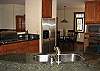 Don't miss any of the action when working in this kitchen which looks out into the living and dining rooms and has a beautiful ocean view.