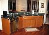 The kitchen has granite counter tops and stainless steel appliances.