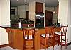 In this photo of the kitchen, you can see the hardwood floors and high-end cabinetry.