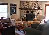 The furniture is very comfortable,and the fireplace adds ambiance. French doors and windows, skylights,and flowing open spaces enhance the rooms architectural features. One can feel the outdoors carried indoors.