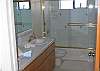 Double sink and tub in this bathroom.