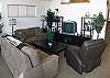 THAT is a comfortable living room!  Relax in this comfortable living room that offers dramatic vaulted ceilings and large view windows to soak in the ocean view.