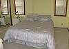 There is a small west-facing balcony off this room with a queen bed.  The owner just put in a brand new featherbed top.  This bedroom is on the middle level, and shares a full bathroom with heated tile floors and heated towel racks.