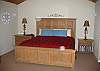 Vaulted ceilings enhance the master bedroom.