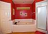 Master bathroom with separate tub and shower