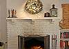 Inviting fireplace and mantel