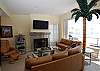 Comfortable living area with fireplace and flat panel TV