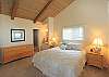 Master bedroom with king bed, and ensuite bathroom.
