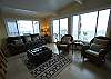 Great living room, with views of the surf and sand, and access to the deck.