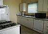 Roomy kitchen with gas stove, dishwasher and microwave.