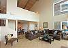 Living room with vaulted ceilings.