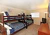 Two Twin over double wooden bunkbeds.