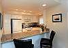 Kitchen with additional informal seating at the counter
