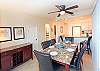 Dining area with marble topped table and matching buffet serving table.