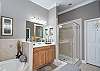Master bathroom with separate shower and soaking tub.