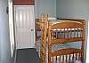Ground Floor:  Bunk beds with standard twin mattresses, laundry room (through door)