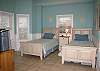Located on the Ground Level, Bedroom 1 has 2 Twin-size beds, a TV, and a private bathroom.