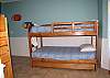 Located on the 2nd level, Bedroom 3 offers 2 Twin-over-Twin bunk beds- each with a trundle bed, and a TV