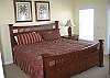 1st Level:  This Master Bedroom, located on the Gulf of Mexico-side of Dune Fine, offers a King-size bed, a large dresser with a TV, and a private bathroom.  This room also opens to the large wrap-around deck on the 1st level.