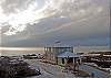 The sun sets in front of Memories by the Sea,adding to the spectacular views - Cape San Blas Vacation Rental