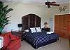 Another view of main level king bedroom with Gulf views, two single fold-outs and private entrance to deck