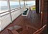 Upper level deck with doors to master bedroom and library