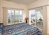 Interior of master bedroom.  View/balcony may change depending on unit location.