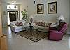 This Large living room has an entire wall of sliding glass doors overlooking the pool, spa and lake.