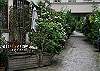 You access the apartment from rue Amelot behind security coded doors. (Rue Amelot is quite nice anyhow) You walk down the Cobblestone courtyard, and the apartment is located half way down the courtyard.