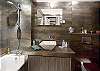 The bathroom of the townhouse includes a full bath with a glass shower door, luxury fixtures and toilet. Lots of mirrors and lights for makeup application.