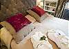 Jump under the cozy covers with your favorite person in this perfectly styled apartment