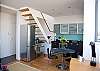 Stairs lead up to loft / secondary sleeping area.