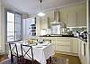 Bright natural light is the perfect partner to professional stainless steel appliances and a warm inviting kitchen