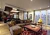 Here is the main room of CobbleStay's premier property. See how the Great Room allows you to relax or entertain in style.  There is a view of the Eiffel Tower from the Terrace as well as the roof deck upstairs.