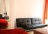 The kids or extra guests will be comfortable on this sofa. There is a great footrest which also serves as a coffee table.
