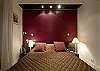 The master bedroom also features a queen size bed with a suitcase rack and ambient lights and reading lights.  Details of the quality of the sheets and linens in the bedroom.  800 thread count sheets. A Change of fresh sheets can be provided during the stay with the Premium Service Upgrade.