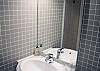 In the main bathroom, you have a full size luxury shower, a spacious sink and dressing area and a washer/dryer at your disposal.  There is also plenty of light.  In the secondary bathroom, you  have a separate sink, mirror and toilet at your disposal.