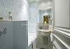 Beautiful blue tile, crisp white tile and full size tub - lovely!