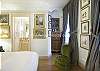 Richly styled throughout, the master bedroom shines with beauty