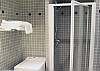 In the main bathroom, you have a full size luxury shower, a spacious sink and dressing area and a washer/dryer at your disposal.