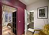 View from the back of the apartment with the door leading into the private master bedroom and separate bathroom.  Bedroom and bathroom can each be independently accessed without disturbing the other room.