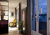 Here is the Eiffel Tower view as you walk to the back of the property towards the Bedroom and Bathroom.  Don't miss the large full length mirror and chair.