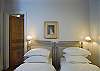 The master bedroom can have both beds pulled together to form a queen size bed.
