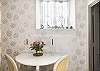 Wakeup and enjoy a steaming cup of coffee and croissant in this adorable apartment