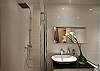 Master bathroom with Full Size Shower.  You can notice the luxury furnishings.  There is a full size tub to the right.