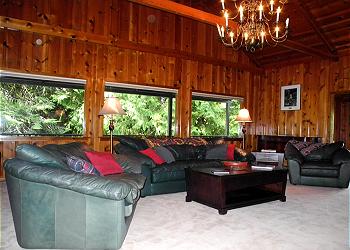 Large, comfortable living room includes lost of seating for watching the Super Bowl.